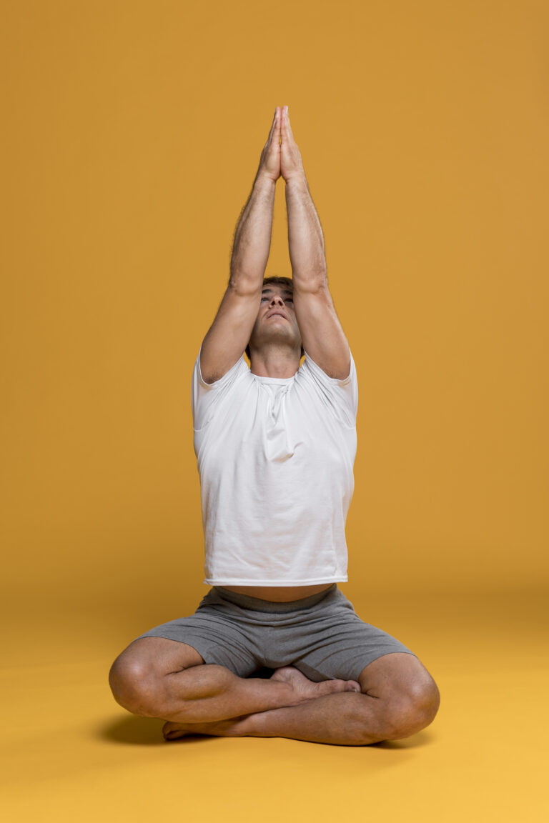 athletic man doing yoga pose